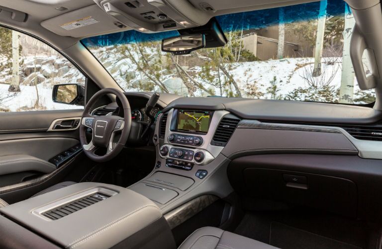 A photo of the front dashboard in the 2019 Yukon Denali.