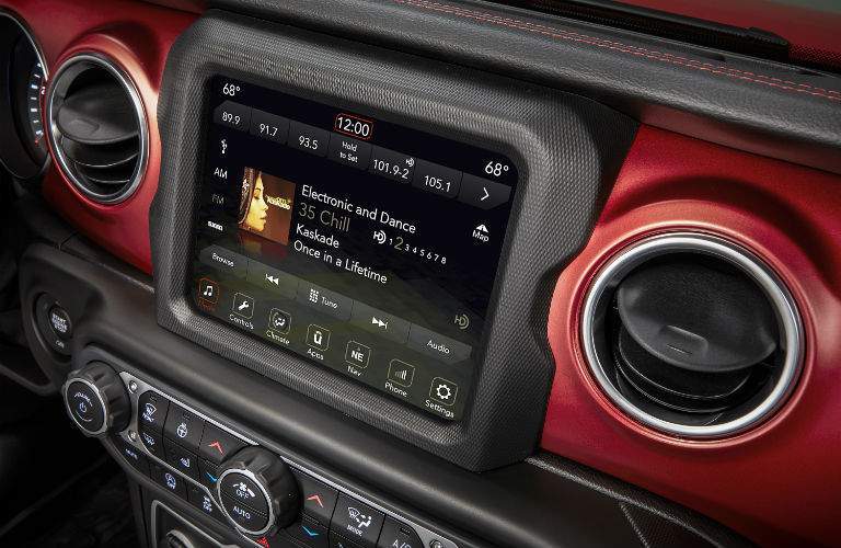 A close up photo of one of the available touchscreen interfaces in the 2018 Wrangler