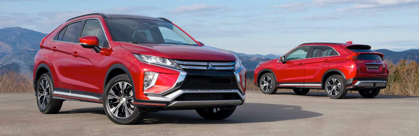 two red 2018 Mitsubishi Eclipse Cross SUVs parked cliffside