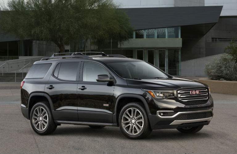 2018 GMC Acadia outside a new house