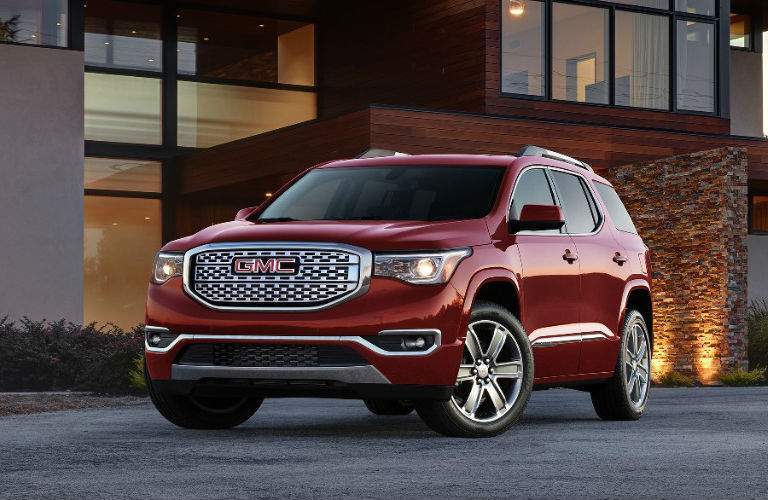 2017 GMC Acadia Denali parked outside an office building
