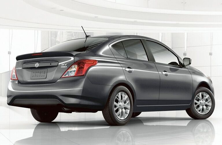 A rear right quarter photo of the 2019 Nissan Versa in a photo studio.