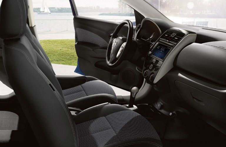 A photo of the front seats and infotainment system used in the 2019 Versa.