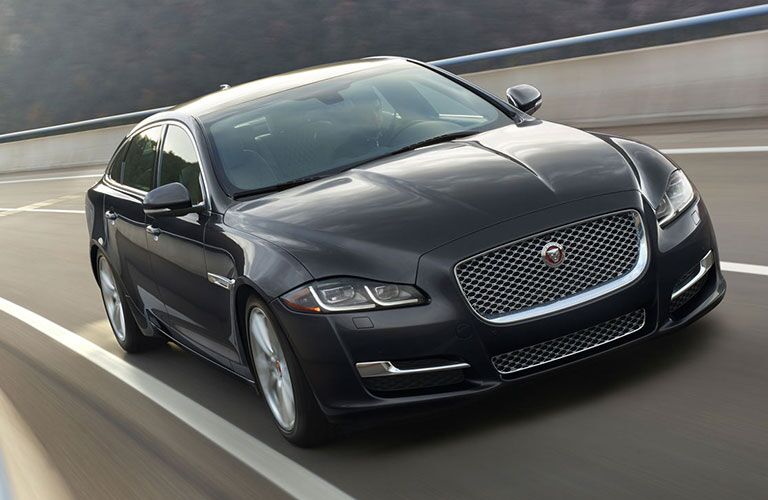 Front view of 2018 Jaguar XJ driving on highway ramp