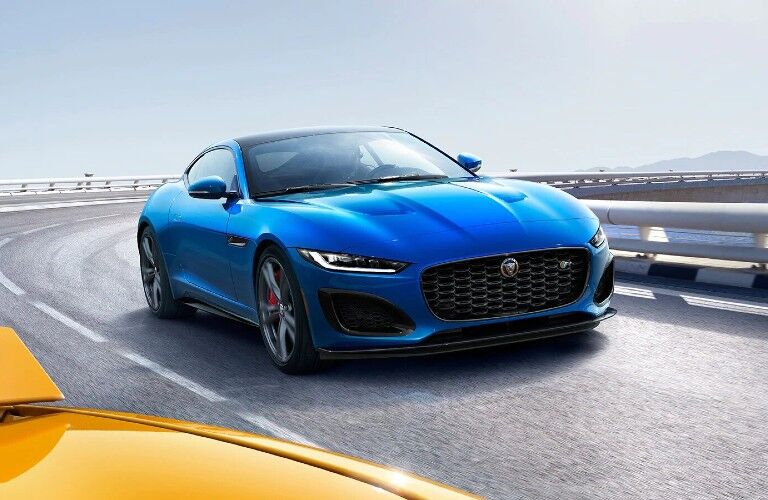 Passenger's side front angle view of blue 2021 Jaguar F-TYPE
