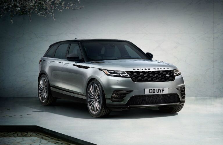 silver Land Rover Range Rover Velar parked outside modern building