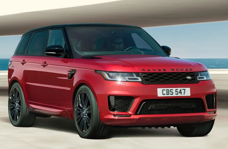 front side view of red Land Rover Range Rover Sport on road