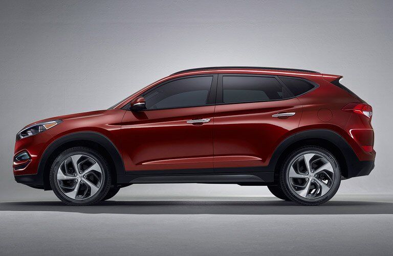 red 2017 Hyundai Tucson side profile