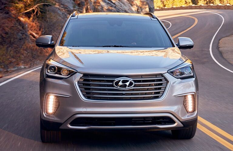Front view of 2019 Hyundai Santa Fe driving on winding highway road