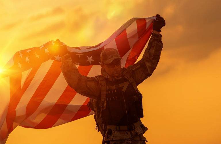 U.S. Military Personnel Holding American Flag