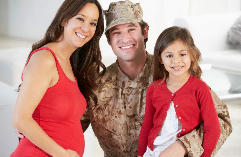 United States Military Soldier with Pregnant Wife and Daughter