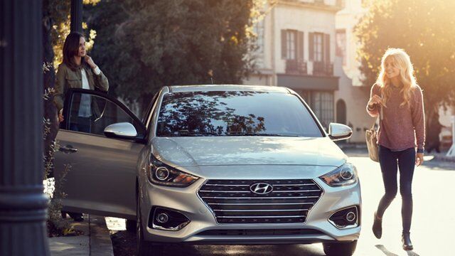 Women Getting Out of Parked Hyundai