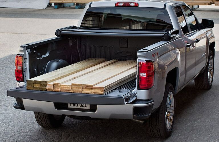 Chevy Silverado 1500 with lumber in the bed