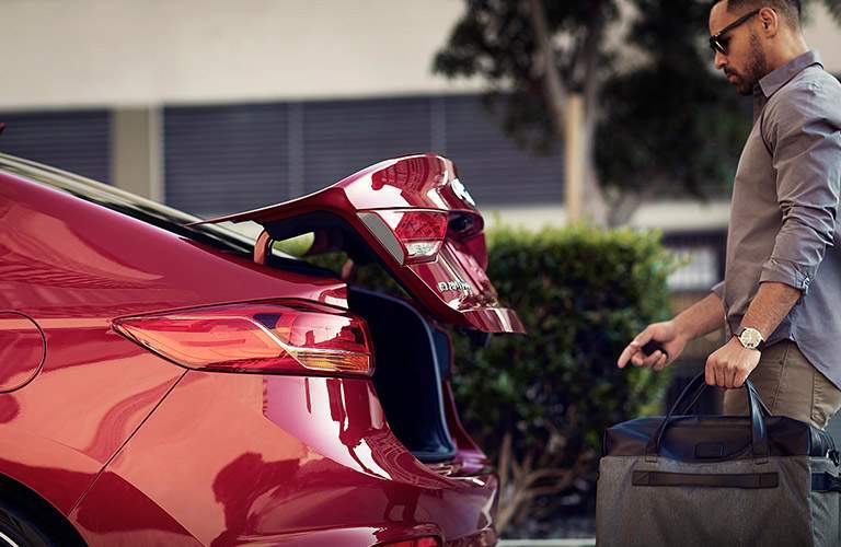 man opening trunk of hyundai elantra