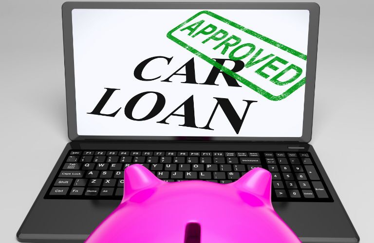 Computer screen showing car loan approved