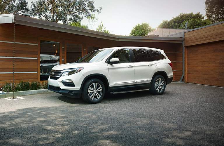 2017 Honda Pilot parked outside fancy house