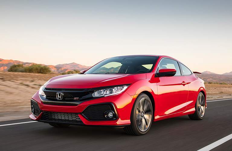 Red 2018 Honda Civic Si on a road by a desert