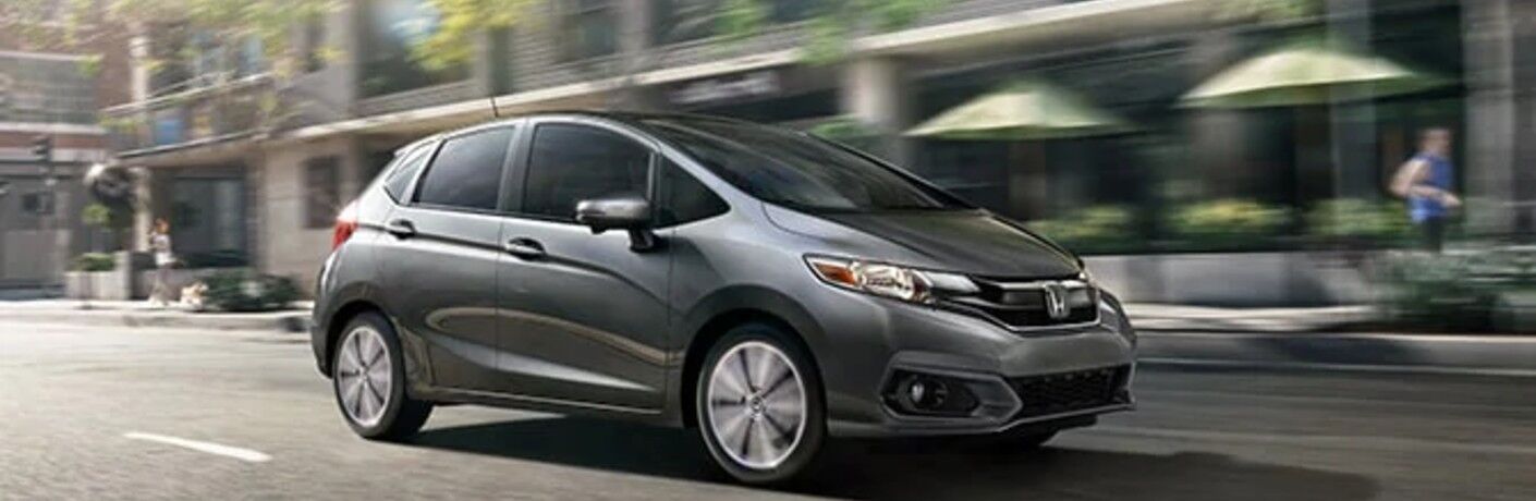grey 2020 Honda Fit driving down the road