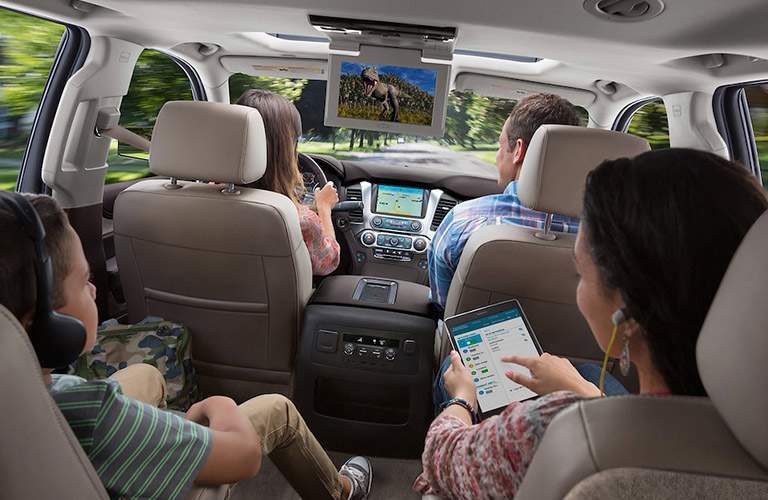 children watching a movie in the chevy suburban