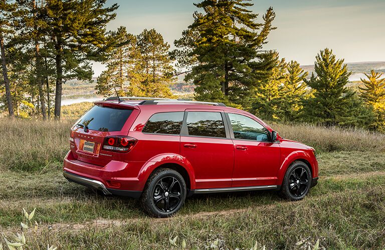 side profile of red 2018 Dodge Journey driving off-road