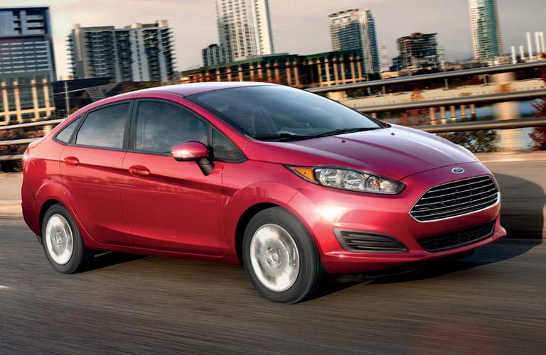 red ford fiesta on highway
