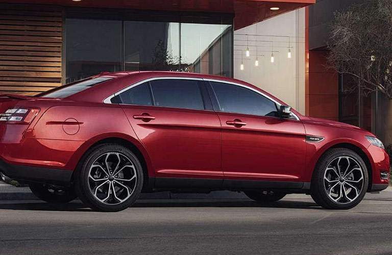 red ford taurus on street
