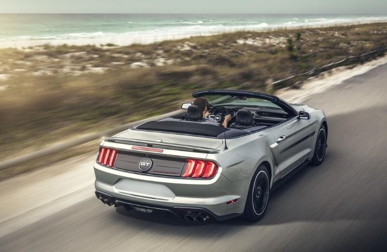 2020 Ford Mustang driving on the road rear view