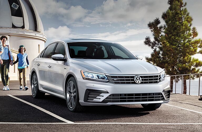2019 VW Passat parked and being approached by family