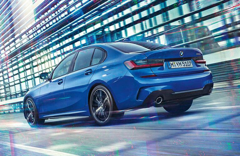2019 BMW 3 Series exterior rear driver side view as it drives away