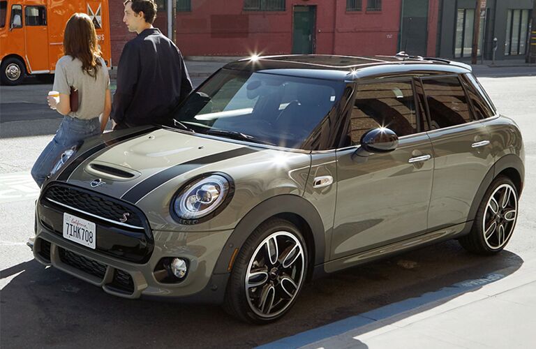 people leaning against 2017 MINI Cooper