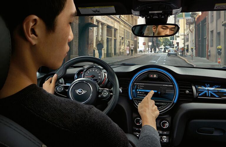 man using touchscreen in 2017 MINI Cooper