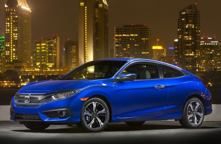 2018 Honda Civic with nighttime city skyline in the background