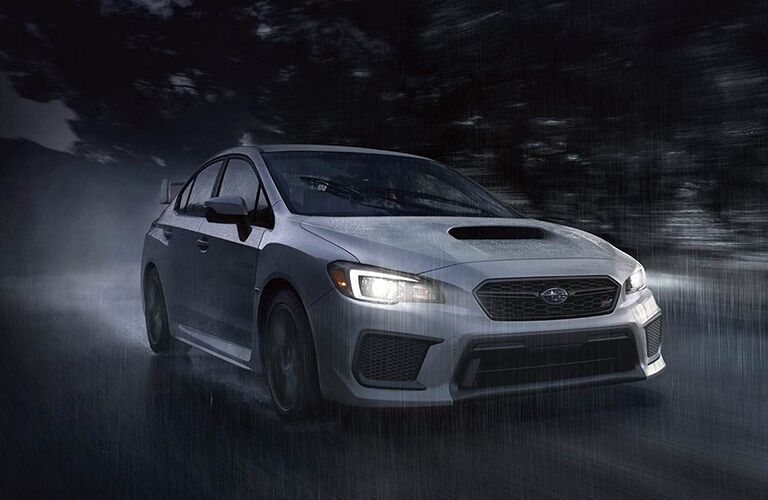 2019 Subaru WRX at night driving through rain