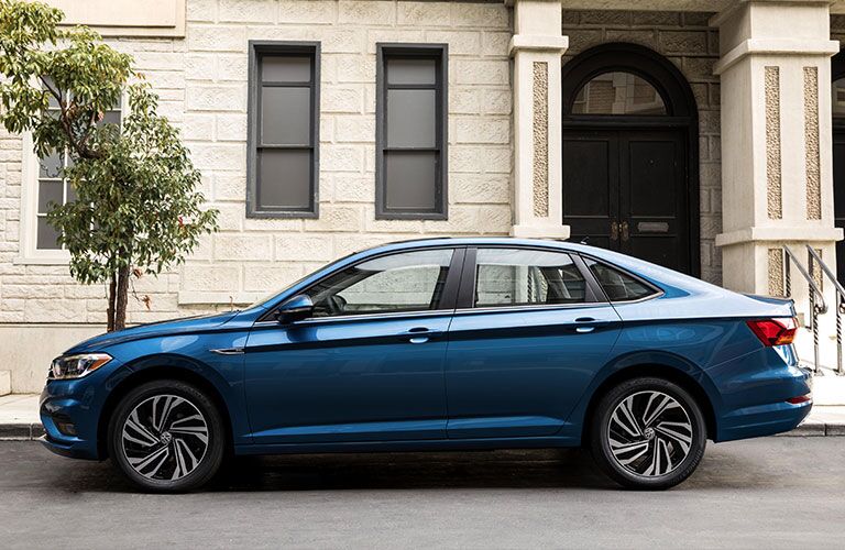 A photo of the VW Jetta in front of a building.