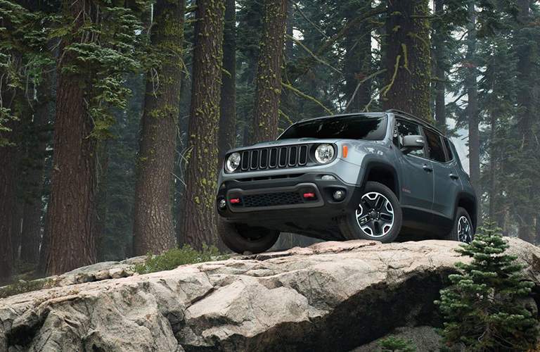 gray jeep renegade on rocks