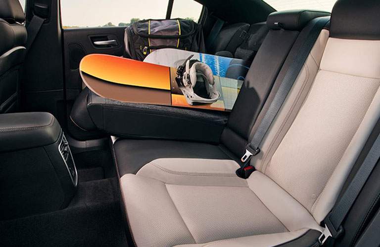 snowboard in back seat of dodge charger