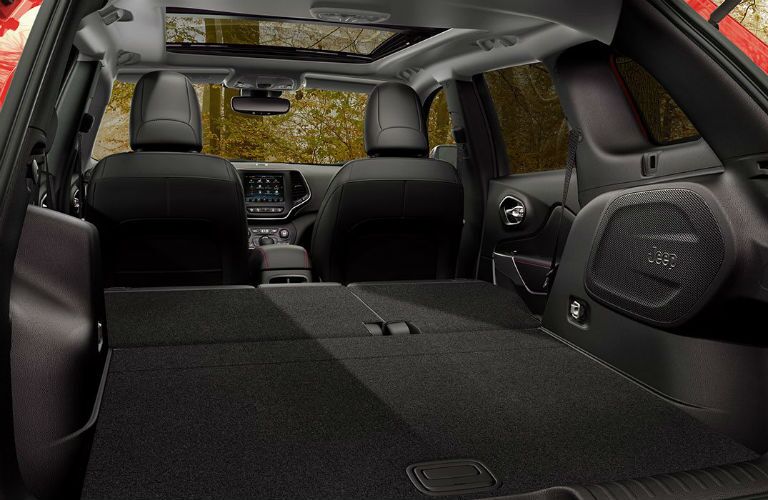 rear cargo space of 2019 jeep cherokee with rear seats folded down