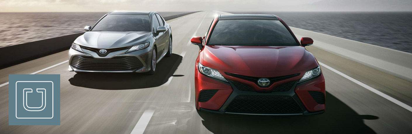 750 Toyota Uber Driver Incentive And Rebate Hattiesburg Ms Gray And Red 2018 Toyota Camry Models On Bridge With Uber Logo In Foreground