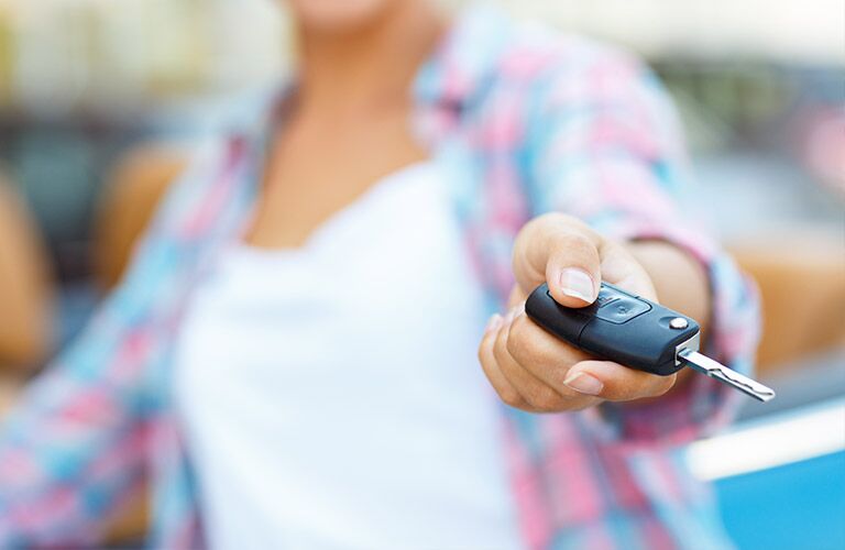Close Up of Woman's Hand Holding New Car Keys