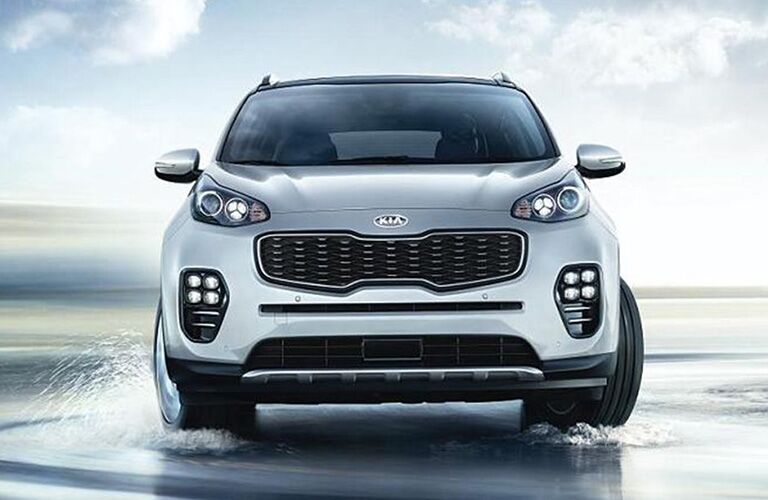 front view of white 2019 kia sportage including grille and bumper