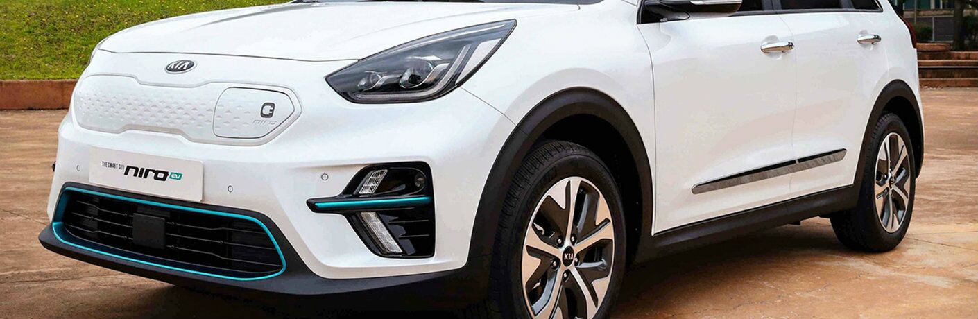 Front shot of white 2019 Kia Niro EV with charging port in view