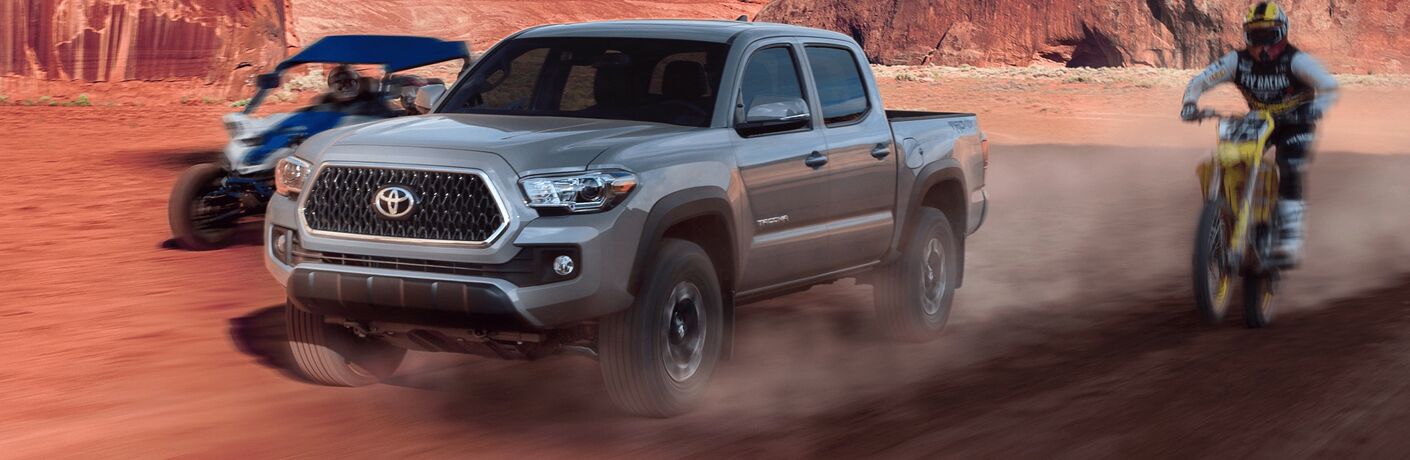 2019 Toyota Tacoma zooming with bikes