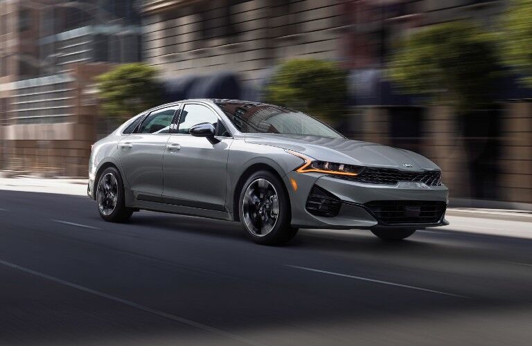 2021 Kia K5 driving on a road