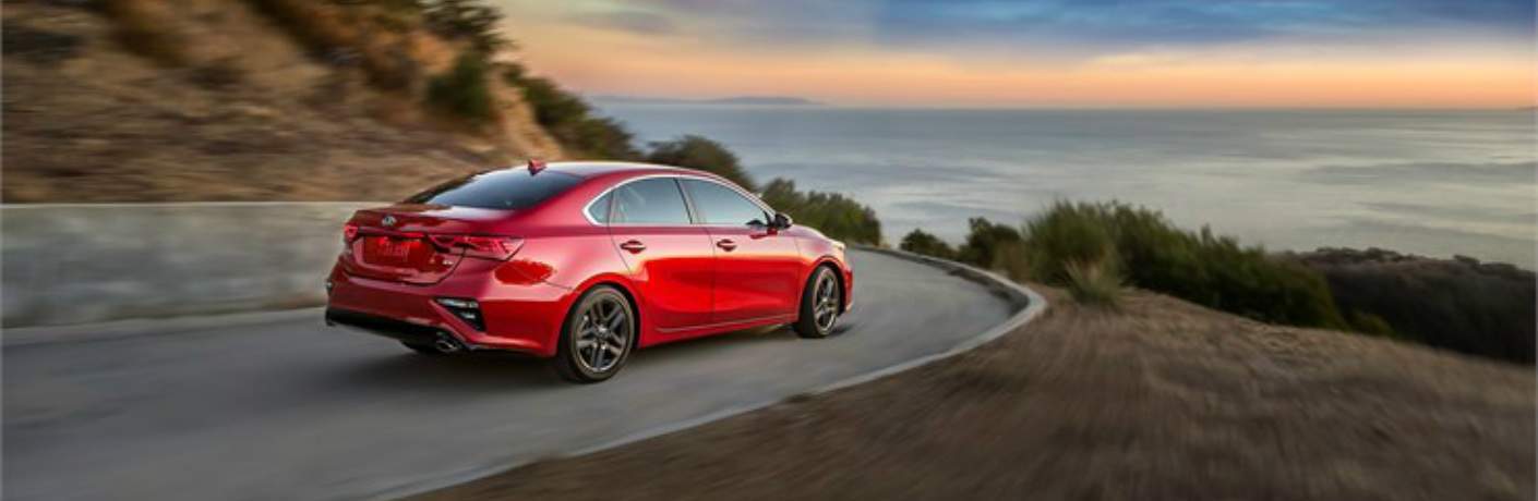 red 2019 Kia Forte making a sharp left turn