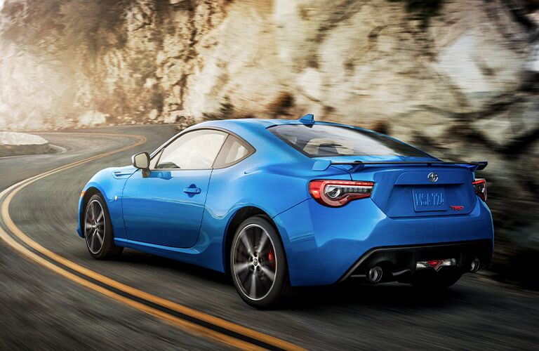 Blue 2020 Toyota 86 driving on a mountainous road