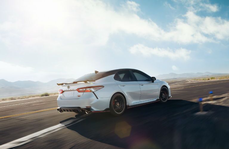 White 2020 Toyota Camry with mountains in the background