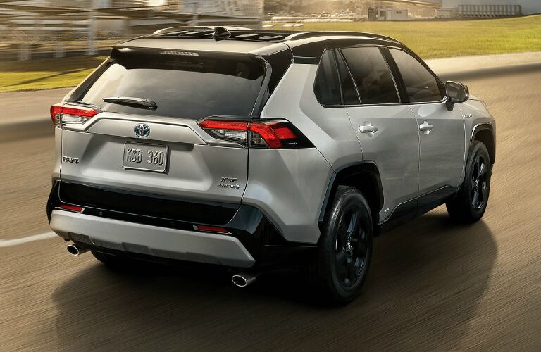 Passenger's side rear angle view of silver 2020 Toyota RAV4