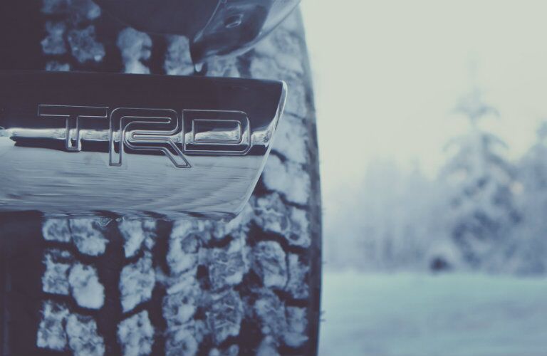 TRD logo with snowy tire