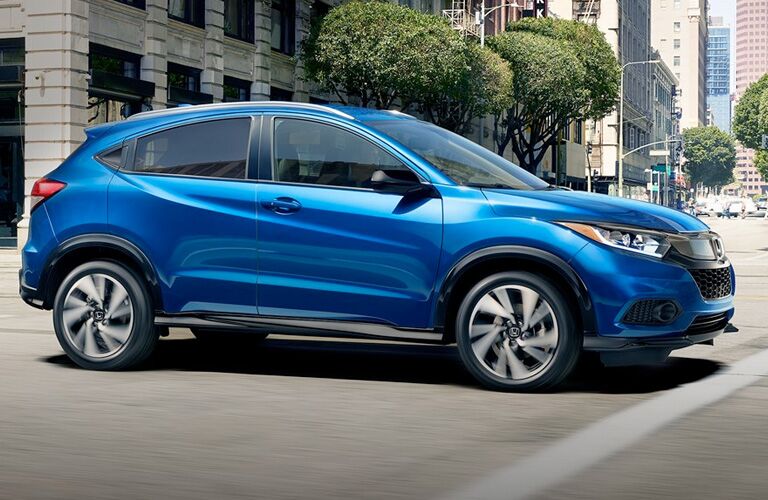 right side view of royal blue honda cr-v