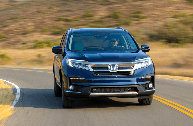 front view of blue honda pilot